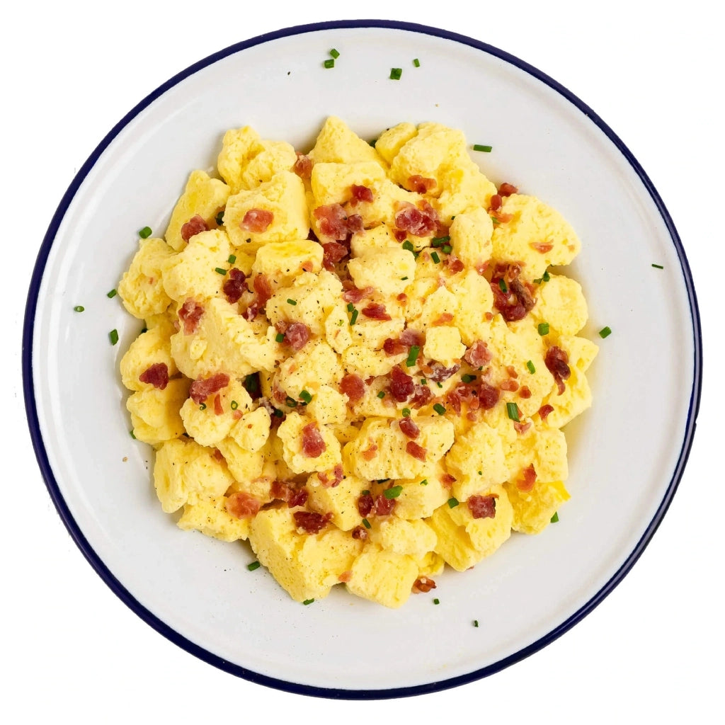 Mountain House Freeze Dried Scrabbled eggs and bacon prepared in a dish.