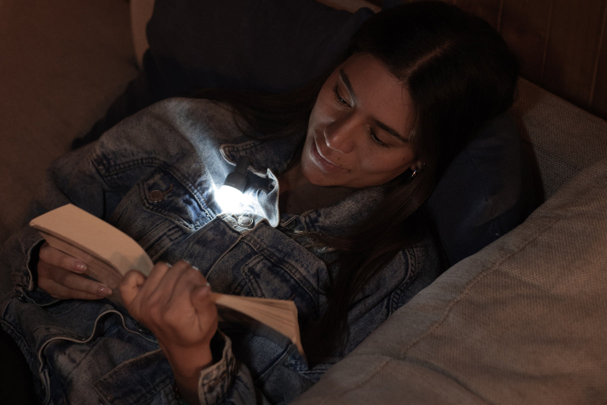 BioLite Site Lights illuminating a book with glowing bulbs