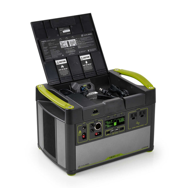 Goal Zero 1400 Lithium portable power station with dual usb and a usb c port. The Power station is a black and green design with a storage compartment for cable management.