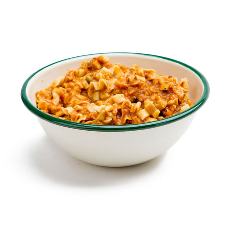 Green ringed white bowl of the prepared vegetarian lasagna noodles.