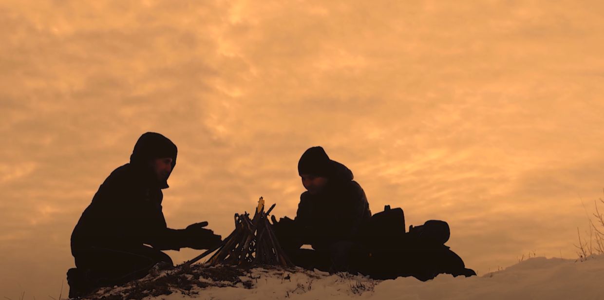 huddling around a fire in minus 40 Celsius