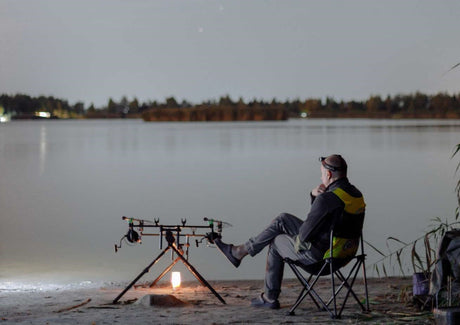 prepper using a bat fishing method at night 