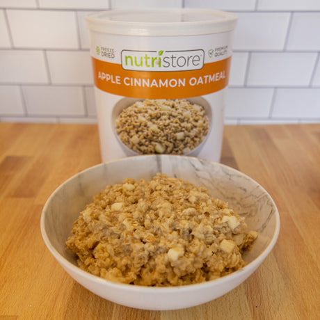 Nutristore #10 Can Freeze Dried Apple Cinnamon Oatmeal Can and bowl filled with prepared freeze dried apple cinnamon oatmeal