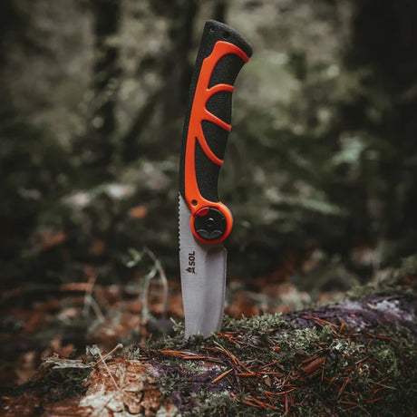 Outdoor multi-tool with pivoting blade and fire starter