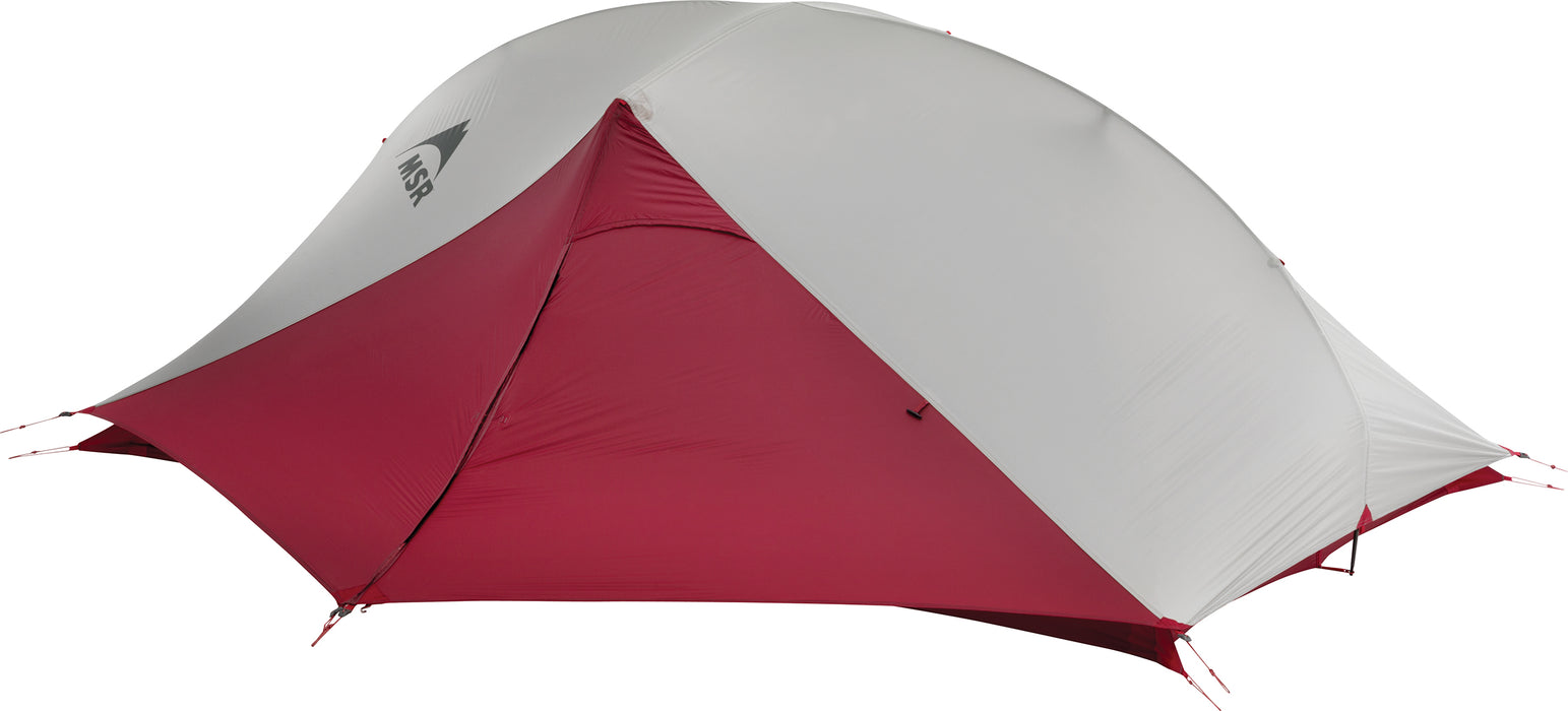 The weather cover of the MSR Carbon Reflex 2 Person tent in deep red and grey with the MSR logo printed in black on the middle of the tent.