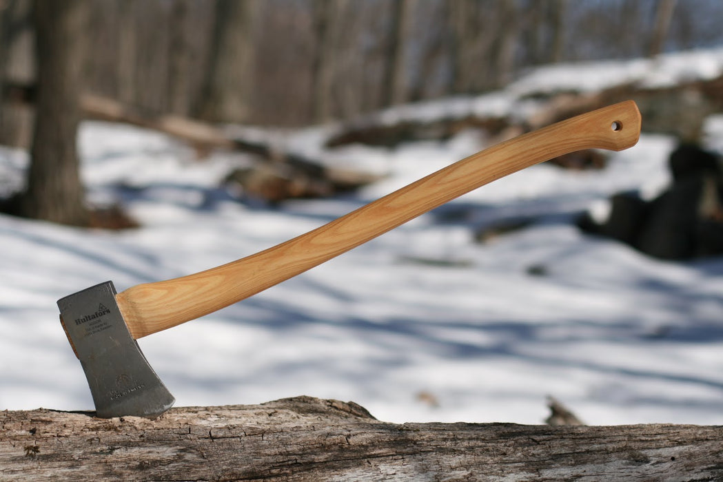 Hultafors Felling Axe forced into a tree log for later use.