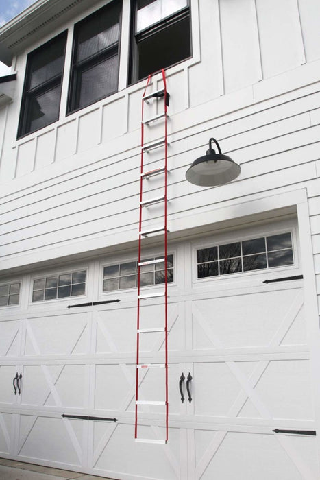 KIDDE United Technology 25 Foot Compact Emergency Escape Ladder hanging from a 2-Storey house