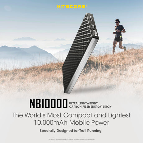 Nb10000 ultra lightweight carbon fiber energy brick. The world's most compact and lightest 10,000mAh mobile power, specially designed for trail running. A runner is jogging across a hillside with clouded mountain tops in the background.