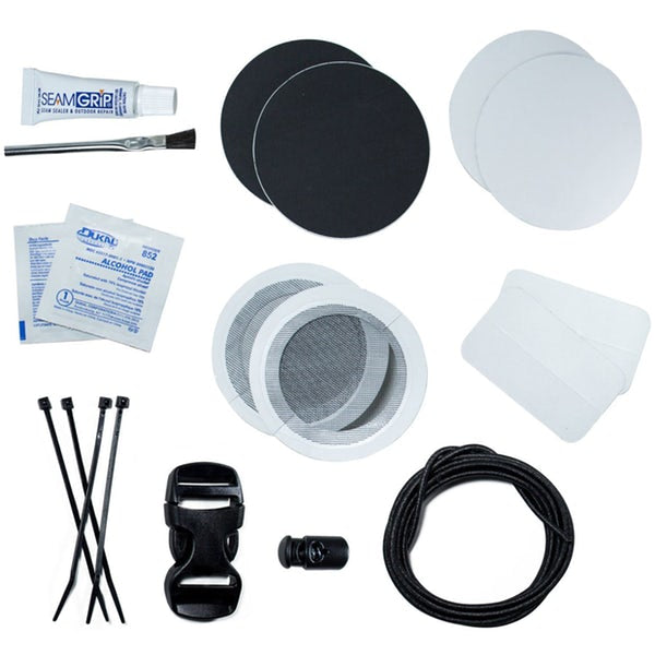 The contents of the Gear Aid Fix Anything Camp kit. Seam Grip, Alcohol Pads, Tenacious tape pads, a drawstring replacement, and cable ties.