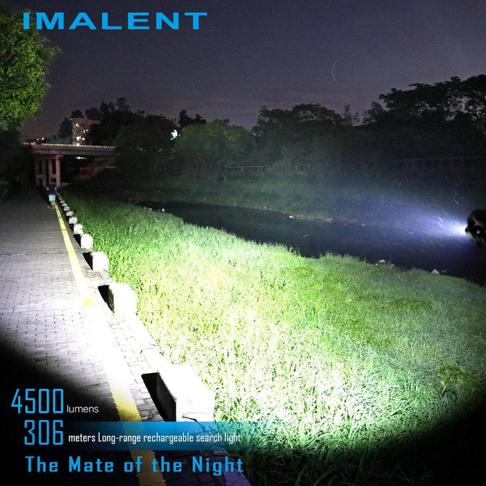 The Imalent DM70 being tested at night, a pond and jogger are shown.