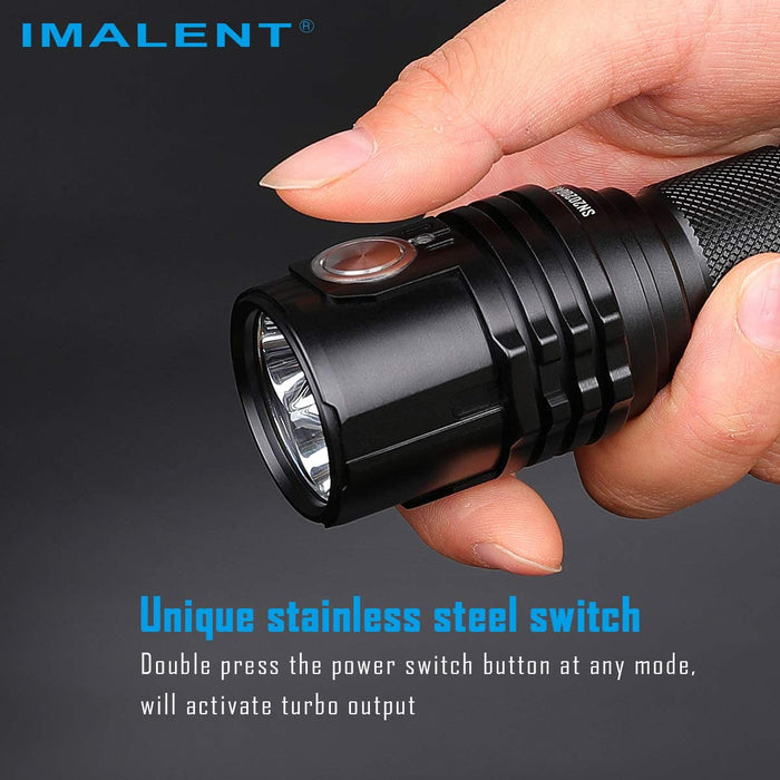 A person using the stainless steel power switch on the imalent ms03 flashlight.