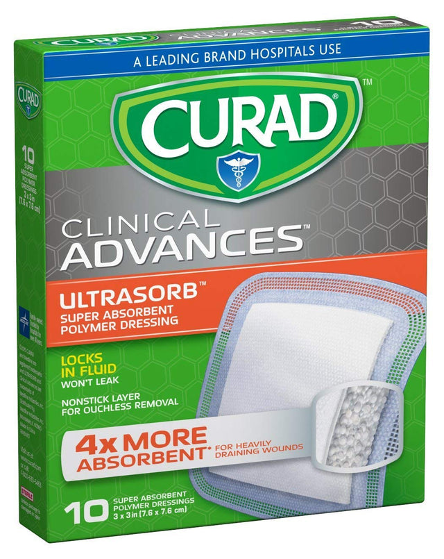 Curad Clinical Advances Ultrasorb Absorbant Wound Pad product box with descriptions: 'Locks in fluid' 'nonstick layer for ouchless removel' '4x more absorbent for heavily draining wounds' and 'A leading brand hospitals use'. The box is coloured in green with a grey honeycomb design and a picture of the wound pad is shown.