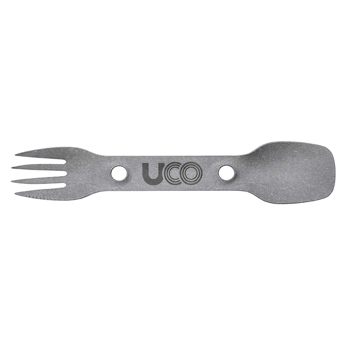 Uco titanium spork, with a fork and spoon on each end. The spork has the UCO logo printed in the middle and there is a grain texture design overal.