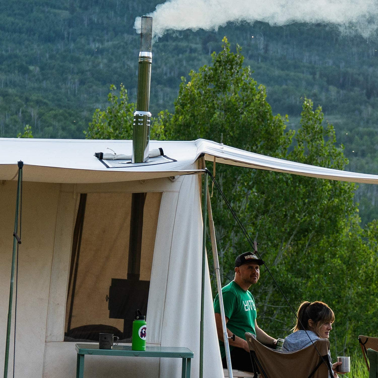 Winnerwell Triple-wall Heat Protector Chimney in use in a tent outdoors