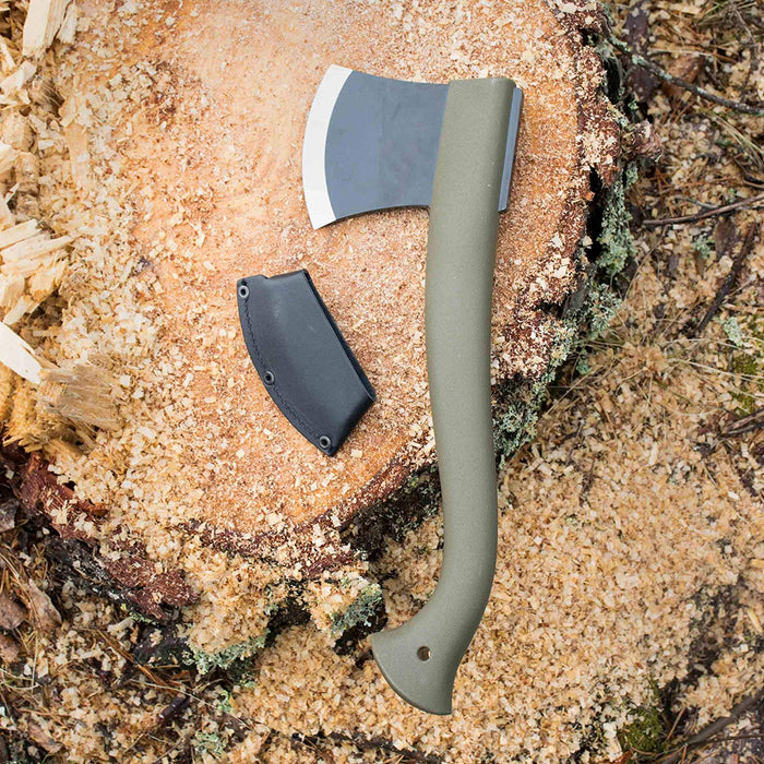 Morakniv Boron Camping Axe with Black leather Sheath on a stump covered in wood chippings. The axe shaft is an olive color and the blade is black with a stainless steel tip.