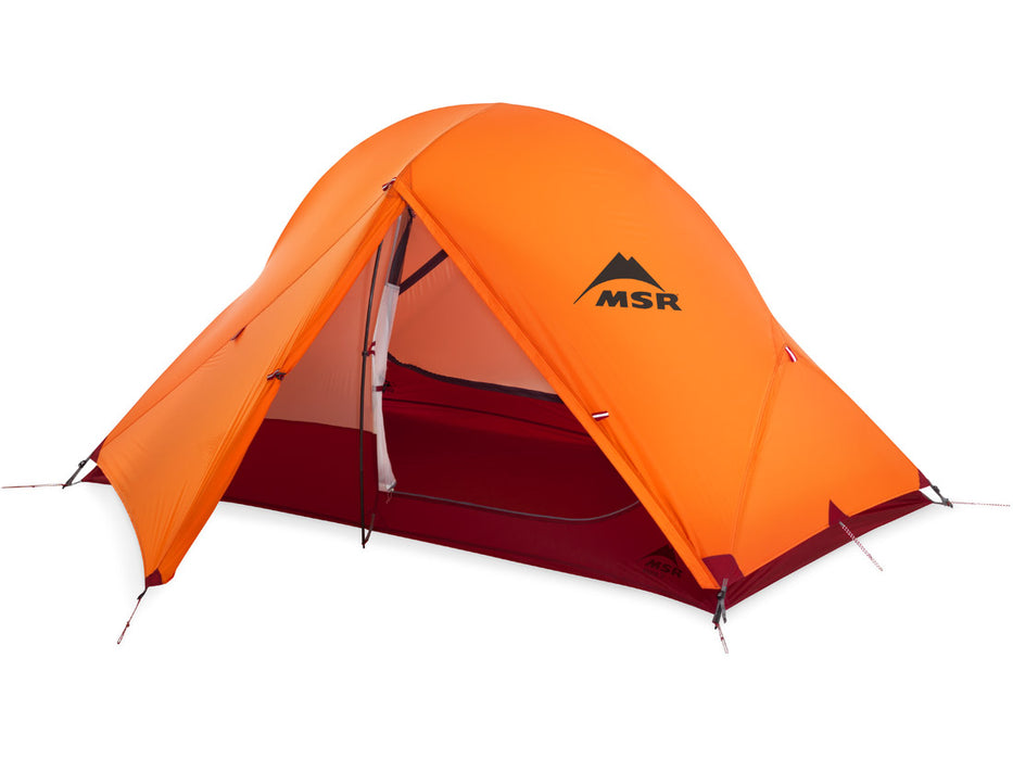 MSR Access 2 person 4 season Tent orange weather cover placed on the tent body. The entry way is shown open with a storage area under the weather cover.