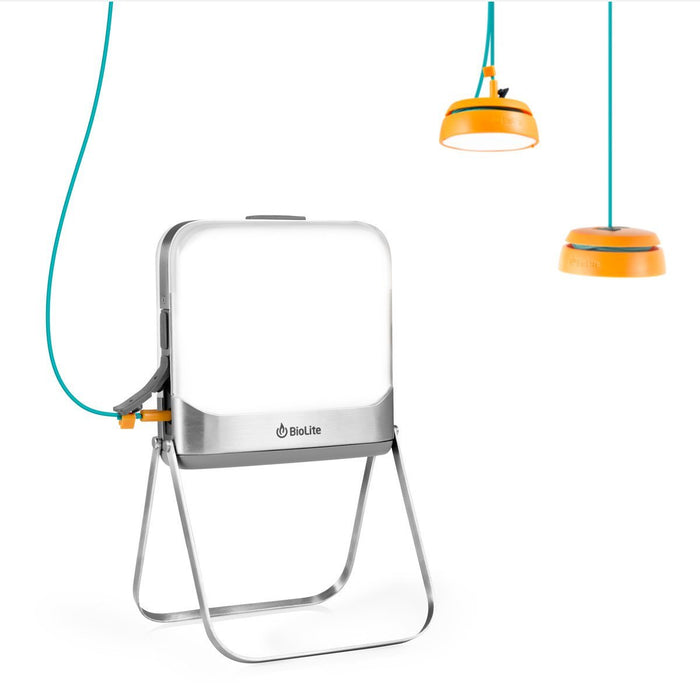 2 powered hanging lights attached to the Biolite BaseLantern XL Bluetooth Lantern & XL Power Hub via usb.