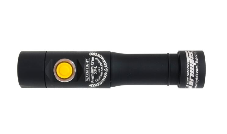 view of the armytek prime c2 flashlight showcasing the yellow power button and 'warm light premium cree xp-l' description