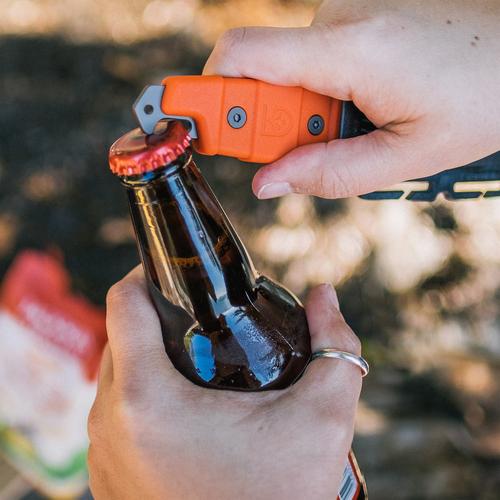 Buri Adventure knife's bottle opener being used to open a glass bottled beverage. 
