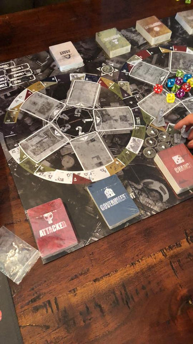 A person is about to play a chance card on the Conflicted Survive the Apocaplypse game board.