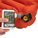 KLYMIT USB rechargeable pump use example on orange sleeping pad