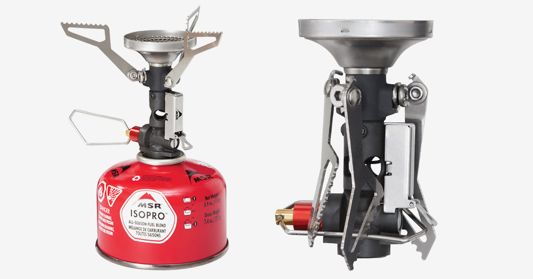 MSR Pocketrocket Camping Stove attached to a ISOPRO propane tank. The propane tank is red and the camp stove top is black with aluminum legs and firepit.