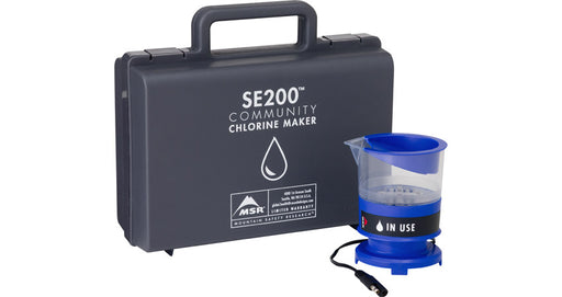 Mountain Safety Research Chlorine Based Purification Kit. The carrying case is a black hard plastic briefcase design and the chlorine maker is a royal blue.