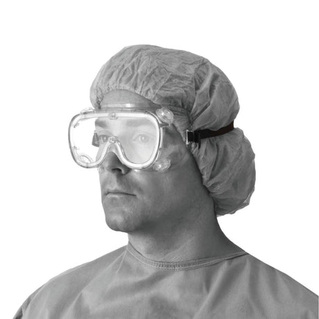 Fluid Protective Goggles on a man wearing a hair net and hospital gown.