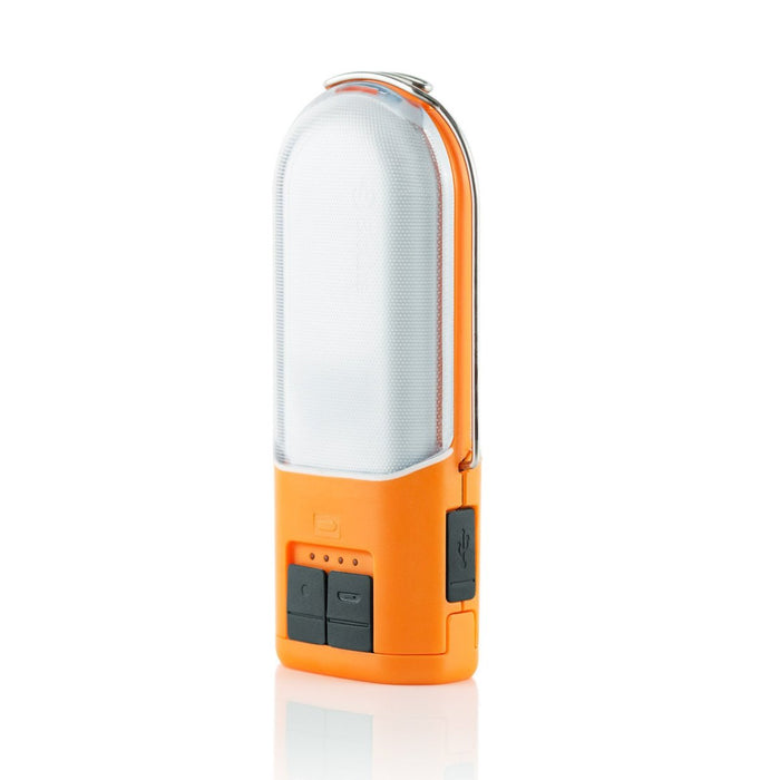 Front of the Biolite PowerLight 250 Lumen Lantern & USB Power Hub with usb charge in and out ports with water proof seals. The lamp is coloured with an orange accent and the light is a clear plastic.