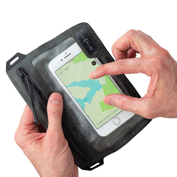A person operating the touchscreen of their smart phone through the clear material of a Nite-ize waterproof packing cube pocket case.