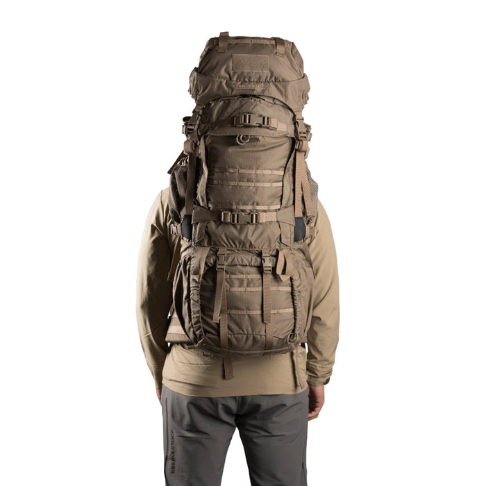 Man carrying Eberlestock Destroyer Dry Earth color Backpack