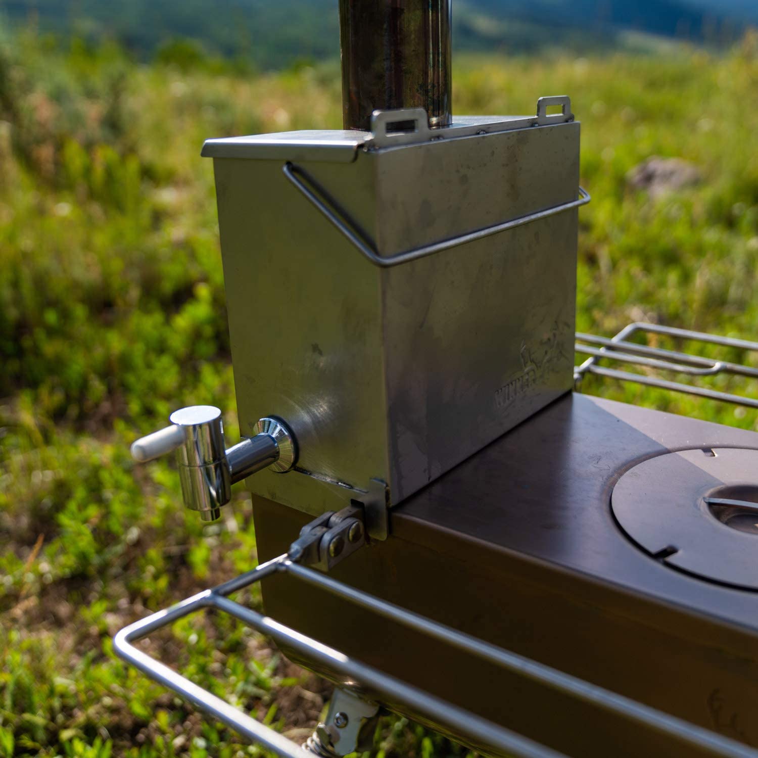 Winnerwell Water Tank for Woodlander in use on a woodstove outdoors