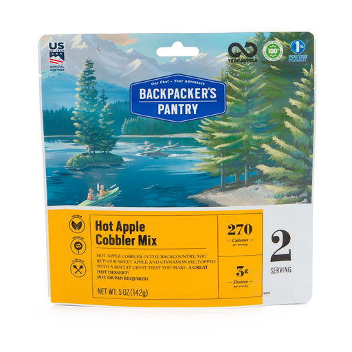 Freeze dried bag of backpackers pantry hot apple cobbler mix with descriptions '270 calories' '3 grams of protein' and '2 servings.' The package has a beautifully drawn image of 2 people in a 2 person kayak sighting seeing.