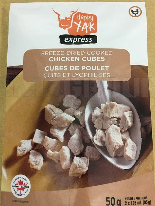 Package of Happy Yak Express Freez-Dried Cooked Chicken Cubes. The label 'Proudly made in Quebec Canada' is on the front cover with a picture of a spoon scooping the freeze dried chicken bits out of a mustard coloured bowl..