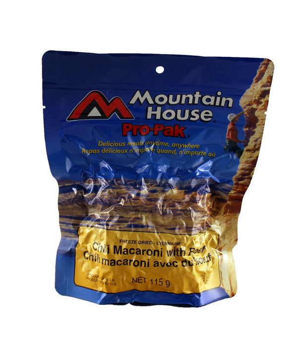 Mountain House Pro Pak of Chili Macaroni with Beef vacuum sealed package. On the cover is a climber wearing a red shirt and white helmet climbing a canyon rock face in the sun.