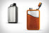 The GSI Boulder Flask in orange and black, with whiskey filled up in the orange version. 