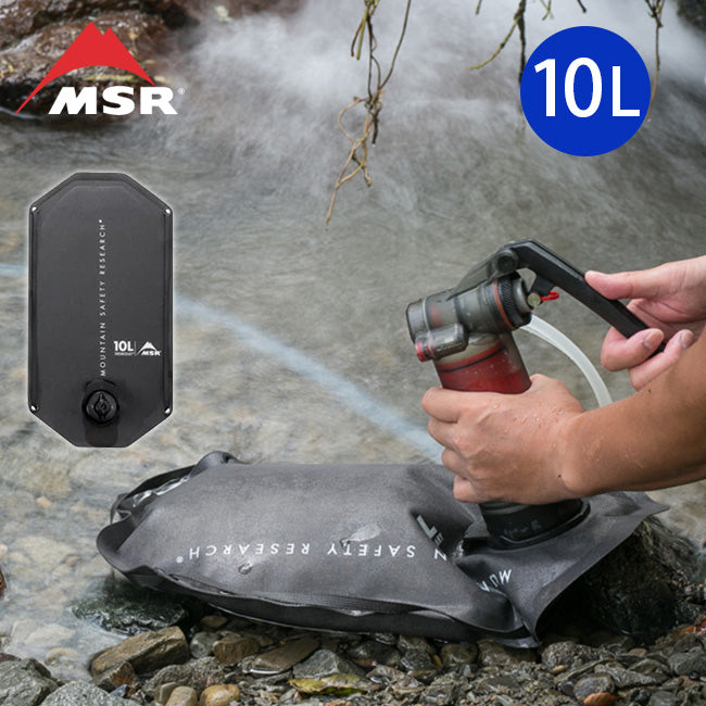 A person using the MSR Guardian Water Purifying system to fill a Rugged water storage bag with creek water. 