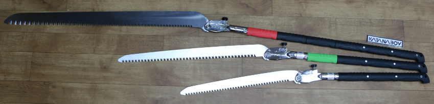 The Largest Katanaboy 1000mm folding saw along side to other smaller variants in black and green.