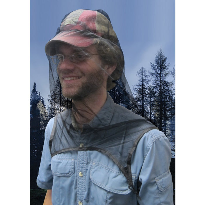 Man with glasses smiling and wearing the Ultranet Head Net over his hat outdoors.