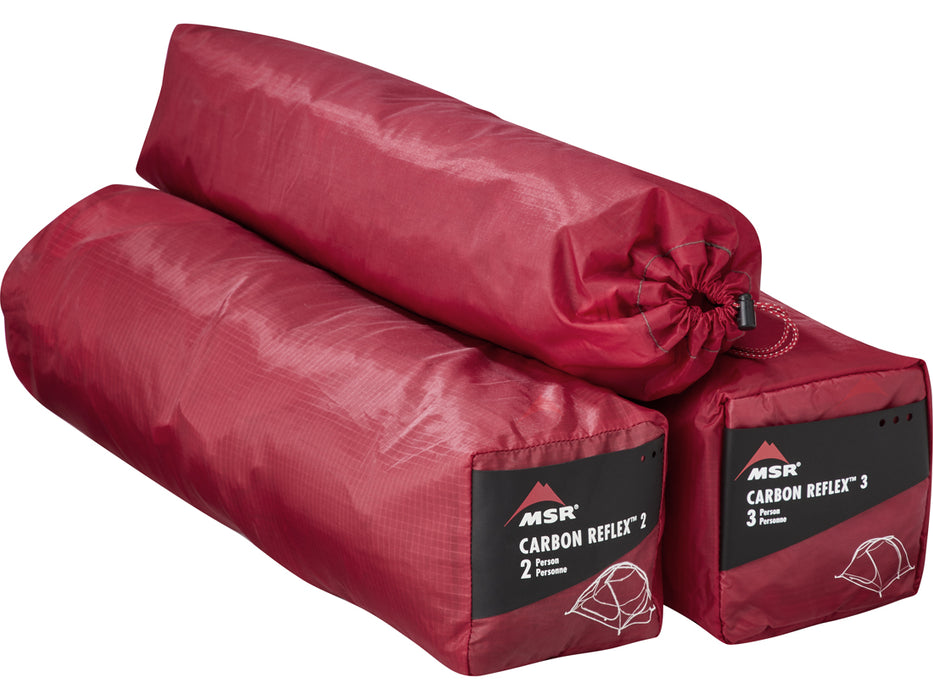The carbon reflex 1, 2, and 3 person tent bags in a deep red colour on a whitebackground.