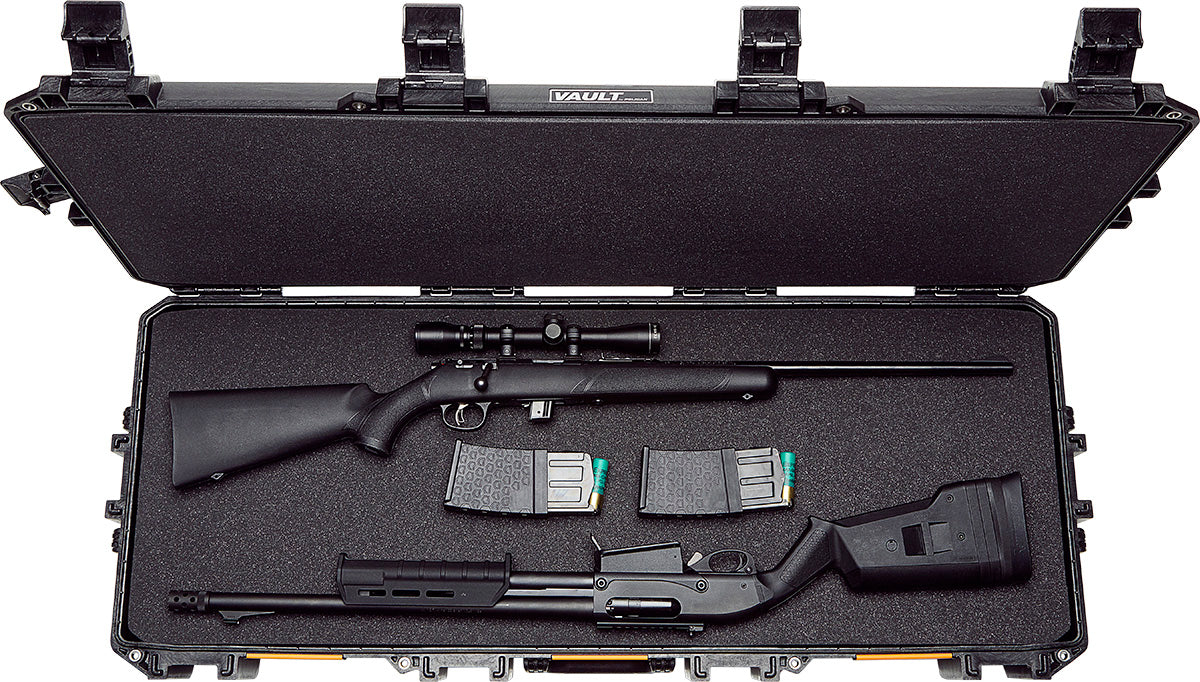 A sniper rifle with two magazines and an automatic shotgun in black paced in the foam liner of the Pelican V730 Tactical Gun Case.