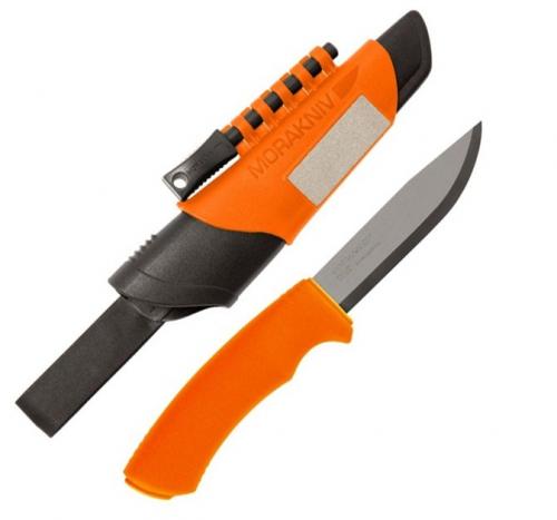 A orange and black Morakniv Bushcraft stainless steel survival knife with attached fire starter on the sheath.